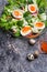 Fresh  gourmet salad with  red  salmon caviar and  eggs and vegetables.  Protein luxury delicacy  healthy food. beautifull served