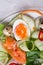 Fresh  gourmet salad with  red  salmon caviar and  eggs and vegetables.  Protein luxury delicacy  healthy food. beautifull served