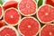 Fresh grapefruits on color background. Citrus fruits