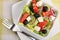 Fresh Greek salad with fork