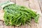 Fresh green Acacia pennata on wooden table background