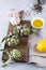 Fresh green artichokes on cutting board ready to cook and ingredients garlic, lemon and olive oil