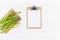 Fresh green asparagus with paper clipboard mockup