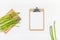 Fresh green asparagus with paper clipboard mockup