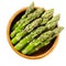 Fresh green asparagus tips in wooden bowl