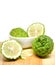 Fresh Green Bergamot or Leech Lime fruit slice on wooden plate