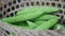 Fresh green bitter melon in a bamboo basket