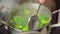 Fresh green broccoli florets gently boiling in a pot of water, releasing steam and filling the kitchen