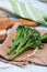 Fresh green broccolini on table