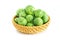 Fresh green brussel sprouts vegetable in a basket on white background