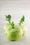 Fresh green cabbage turnip on white wooden kitchen plate