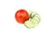 Fresh green chopped cucumber and whole red tomato, two ripe vegetables, salad ingredient, isolated on white background