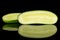 Fresh green cucumber isolated on black glass