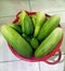 Fresh green cucumbers in a basket freshly picked from the garden for food