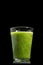 Fresh green healthy cucumber smoothie isolated on black background
