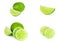 Fresh green juicy limes, lime slices, ice and mint leaves set isolated on white background.