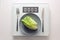 Fresh green lettuce or baby cos on a gray plate and cutlery on a digital weight scale showing zero, healthy diet and lose weight