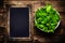 Fresh green Lettuce Salad on blank vintage slate chalk board on