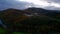 Fresh green meadows, mountains with trees with foliage autumn colors