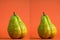 fresh green pears in the shape of a female figure on an orange background, slimming before and after humor concept