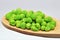 Fresh green peas on wood spoon food nutrition agricolture organic nature