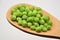 Fresh green peas on wood spoon food nutrition agricolture organic nature