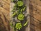 Fresh green peas young in bowls, on wood table, top view, seeds, pods, sprouts