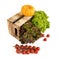 Fresh green and red salad leaves in a wooden box, small pumpkin and branch of cherry tomatoes isolated on white