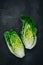 Fresh Green Romaine Lettuce for Caesar Salad on dark stone background