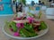 Fresh green salad, lettuce, slices onion and ham served with mayonnaise sauce