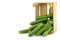 Fresh green snack cucumbers in a wooden box