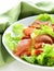 Fresh green snack salad with ham