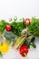 Fresh green summer produce on white table