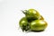 Fresh green tiger tomatoes on white background