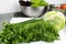 Fresh greens and cabbage close-up on a cutting board