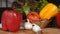 Fresh greens, peppers, onions, zucchini, garlic. Moving vegetables on the kitchen table, the background of the harvest