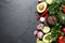 Fresh guacamole ingredients on table, flat lay. Space for text