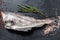 Fresh haddock fish carcass. Black background. Top view