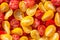 Fresh halves of Mexican cherry tomatoes. Sliced yellow and red cherry tomatoes.Background of many colorful cherry tomatoes. Cherry