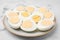 Fresh hard boiled eggs on white marble table