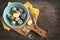 Fresh hard boiled quail eggs with shell beside on cooking board