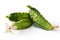 Fresh harvest of cucumbers with blossom isolated on white background. Green gherkins close up.