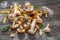 Fresh harvest of porcini mushrooms on wooden table. Lucky result of mushroom picking