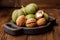 Fresh harvest of walnuts on a wooden background. Green and brown nuts on a beautiful wooden plate. Shell and peel of walnuts.