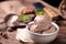 Fresh hazelnut ice cream on wooden table.