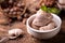 Fresh hazelnut ice cream on wooden table.