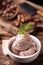 Fresh hazelnut ice cream on wooden table.