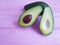 Fresh health avocado vegan on a pink wooden minimalism