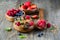 Fresh healthy breakfast with granola and berries, wooden background