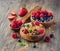 Fresh healthy breakfast with granola and berries, wooden background